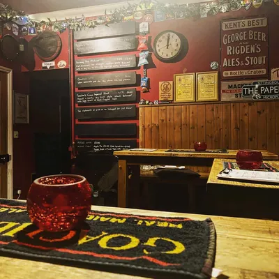 Pub interior with menu boards and clock