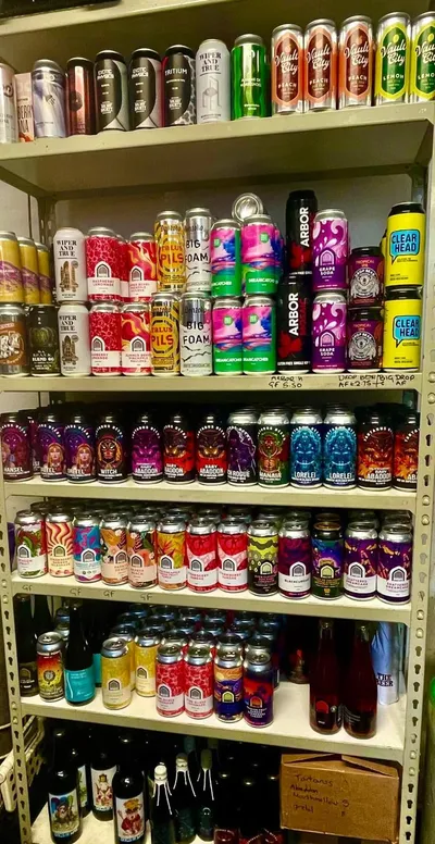 Shelves stocked with craft beer cans