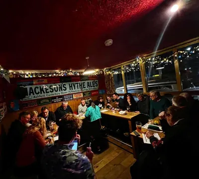 Customers inside busy pub interior
